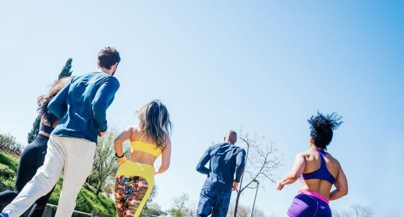 Group of runners training in a park