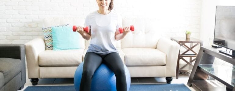 Woman exercising in living room